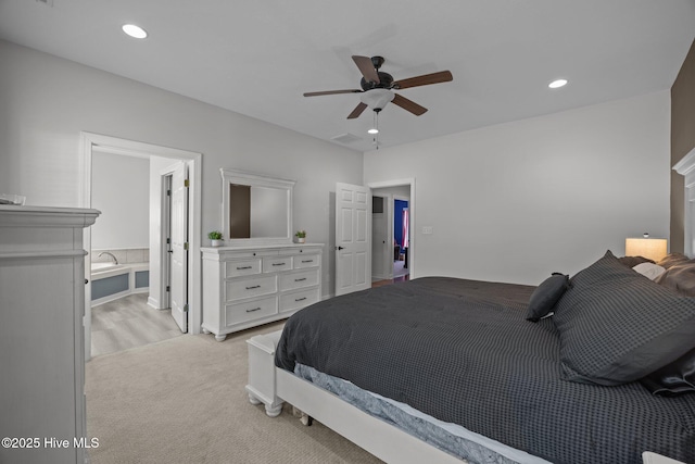115 Marie Ct, Havelock, NC 28532 - bedroom with light carpet, recessed lighting, connected bathroom, and ceiling fan