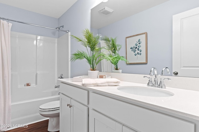 5134 Northstar Dr Unit 28, Leland, NC 28451 - bathroom with toilet, wood finished floors, vanity, visible vents, and shower / tub combo