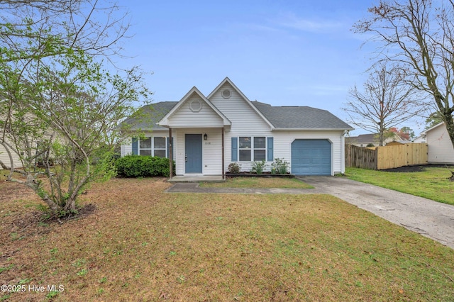 view of front of house with a shingled roof, a front lawn, fence, a garage, and driveway