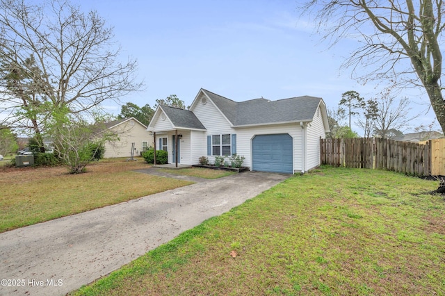view of front of property featuring driveway, a shingled roof, fence, a front yard, and an attached garage