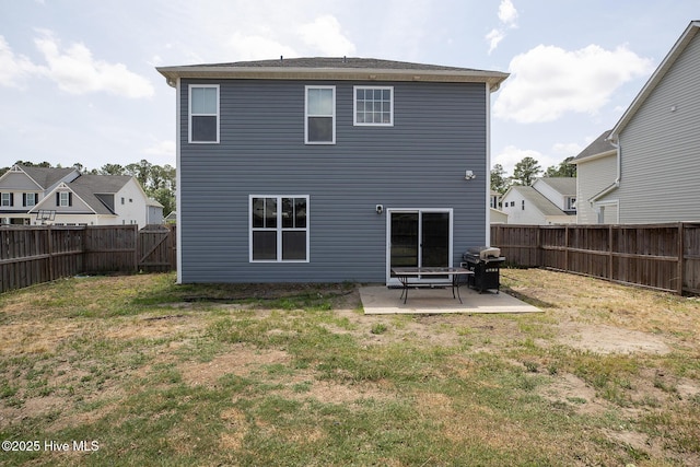rear view of house with a patio