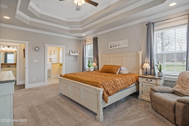 bedroom with a tray ceiling, light colored carpet, ornamental molding, and recessed lighting