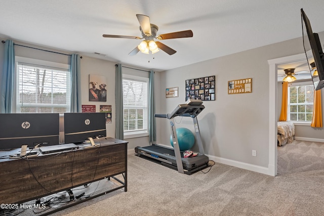 workout area with carpet floors, a ceiling fan, visible vents, and baseboards