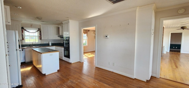 6693 NC-92, Bath, NC 27808 - kitchen with visible vents, wooden counters, a center island, ornamental molding, and wood finished floors
