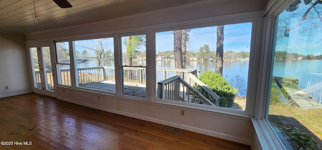 6693 NC-92, Bath, NC 27808 - unfurnished sunroom featuring visible vents, wood finished floors, baseboards, and a water view