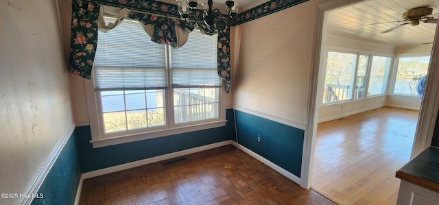 6693 NC-92, Bath, NC 27808 - unfurnished room with a wealth of natural light, visible vents, ceiling fan with notable chandelier, and baseboards