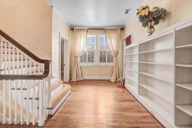 705 Park Ave, Goldsboro, NC 27530 - interior space featuring visible vents, baseboards, wood finished floors, and crown molding