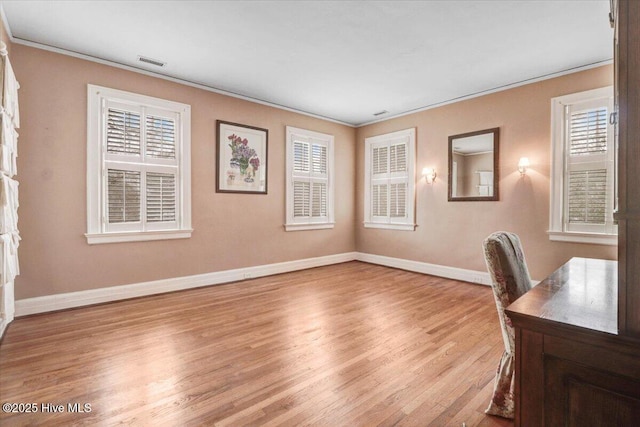 705 Park Ave, Goldsboro, NC 27530 - unfurnished office with crown molding, baseboards, light wood-type flooring, and visible vents
