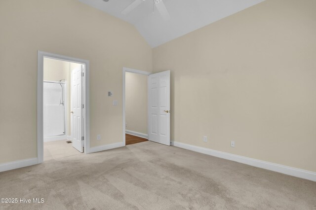 120 E High Bluff Dr, Hampstead, NC 28443 - unfurnished bedroom with vaulted ceiling, carpet flooring, connected bathroom, baseboards, and ceiling fan