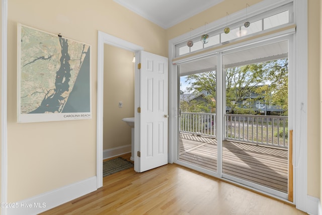 604 Fourth St S, Carolina Beach, NC 28428 - doorway with wood finished floors and ornamental molding