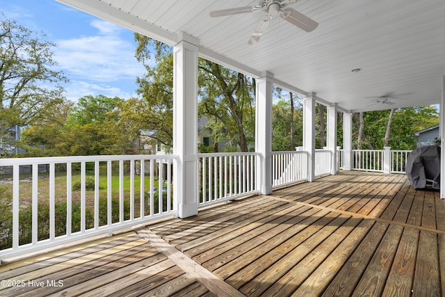 604 Fourth St S, Carolina Beach, NC 28428 - wooden terrace with a ceiling fan, area for grilling, and view of wooded area