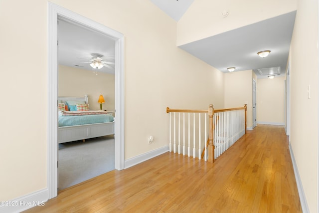 604 Fourth St S, Carolina Beach, NC 28428 - hallway featuring an upstairs landing and wood finished floors