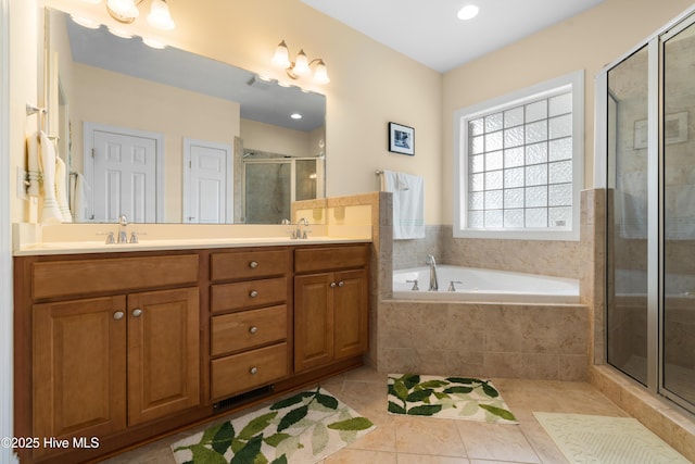 604 Fourth St S, Carolina Beach, NC 28428 - full bath with a stall shower, tile patterned flooring, double vanity, and a bath