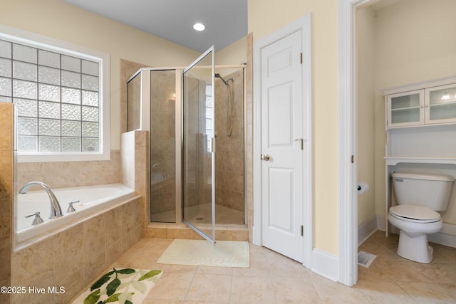604 Fourth St S, Carolina Beach, NC 28428 - full bathroom with tile patterned flooring, a stall shower, and a bath
