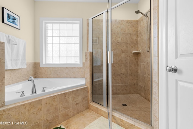 604 Fourth St S, Carolina Beach, NC 28428 - bathroom featuring a bath, a stall shower, and tile patterned floors