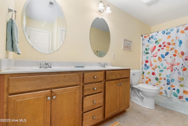 604 Fourth St S, Carolina Beach, NC 28428 - full bathroom with double vanity, curtained shower, and tile patterned floors