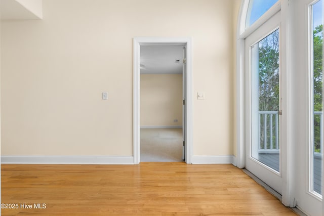 604 Fourth St S, Carolina Beach, NC 28428 - spare room with light wood-style flooring and baseboards