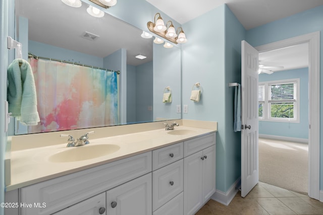 604 Fourth St S, Carolina Beach, NC 28428 - full bathroom with double vanity and tile patterned flooring