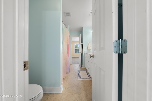 604 Fourth St S, Carolina Beach, NC 28428 - bathroom featuring toilet and tile patterned floors
