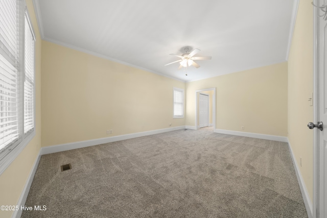 604 Fourth St S, Carolina Beach, NC 28428 - carpeted empty room featuring a ceiling fan and crown molding