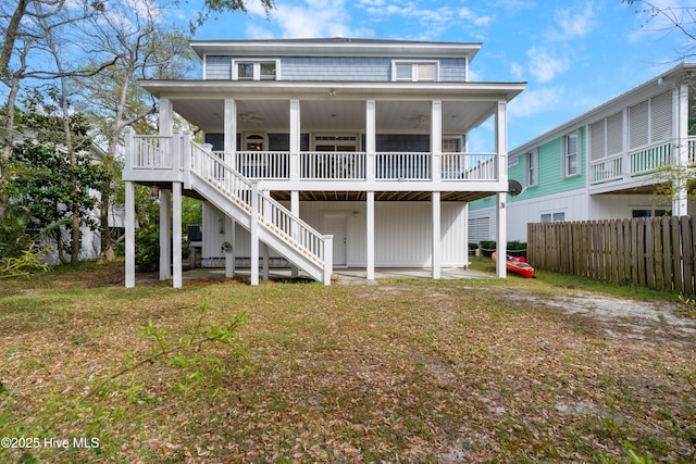 604 Fourth St S, Carolina Beach, NC 28428 - rear view of property with ceiling fan and stairway