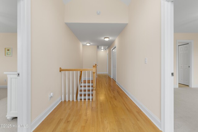 604 Fourth St S, Carolina Beach, NC 28428 - corridor with an upstairs landing and light wood-style floors