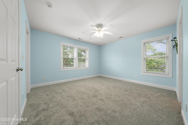 604 Fourth St S, Carolina Beach, NC 28428 - spare room with healthy amount of natural light, carpet floors, and ceiling fan