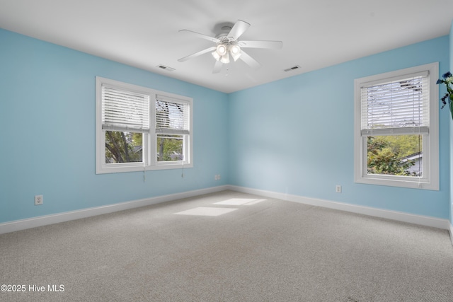 604 Fourth St S, Carolina Beach, NC 28428 - carpeted empty room with plenty of natural light and ceiling fan