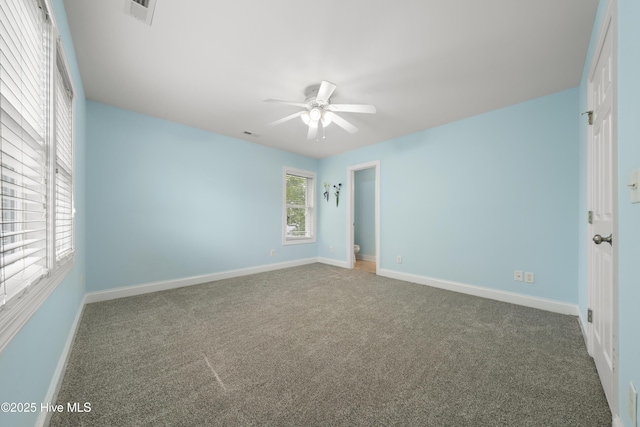 604 Fourth St S, Carolina Beach, NC 28428 - spare room featuring a ceiling fan and carpet flooring