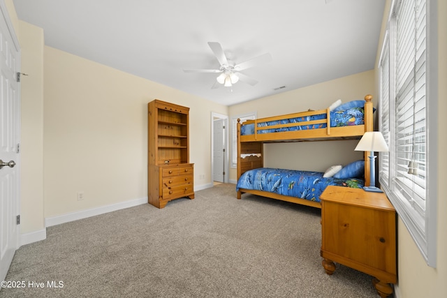 604 Fourth St S, Carolina Beach, NC 28428 - carpeted bedroom featuring baseboards and ceiling fan