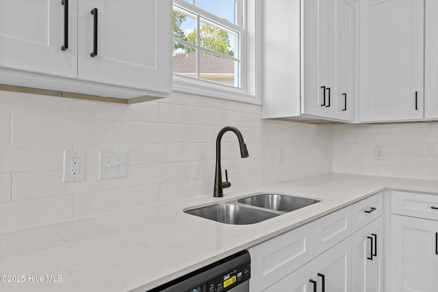1007 Tawney Trce, New Bern, NC 28562 - kitchen with a sink, white cabinetry, backsplash, and light stone counters