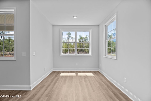 1007 Tawney Trce, New Bern, NC 28562 - unfurnished room featuring healthy amount of natural light and wood finished floors