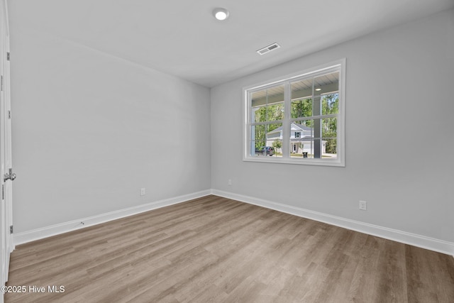 1007 Tawney Trce, New Bern, NC 28562 - spare room with wood finished floors and baseboards