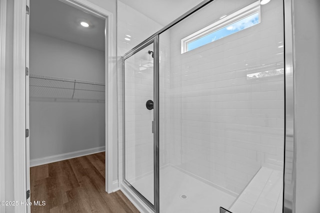 1007 Tawney Trce, New Bern, NC 28562 - full bathroom featuring a shower stall, wood finished floors, and a spacious closet