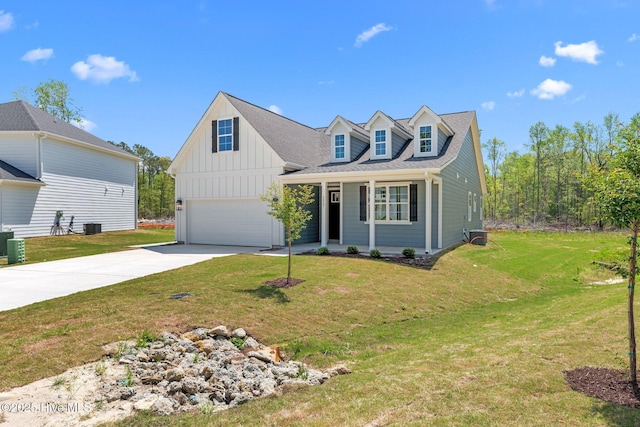 1007 Tawney Trce, New Bern, NC 28562 - view of front of property featuring board and batten siding, concrete driveway, covered porch, a garage, and a front yard