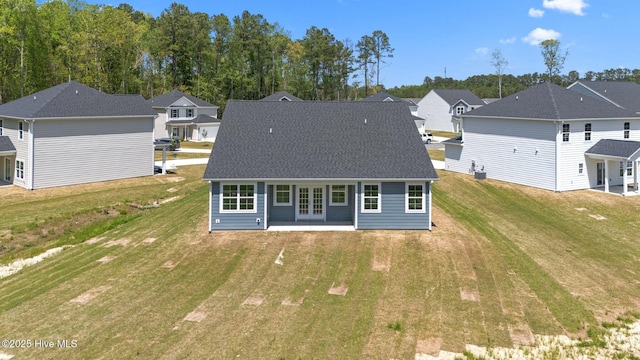 1007 Tawney Trce, New Bern, NC 28562 - back of house featuring french doors, a yard, and a residential view