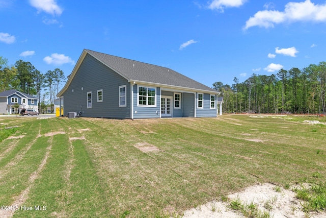 1007 Tawney Trce, New Bern, NC 28562 - back of property with french doors, a lawn, and central AC