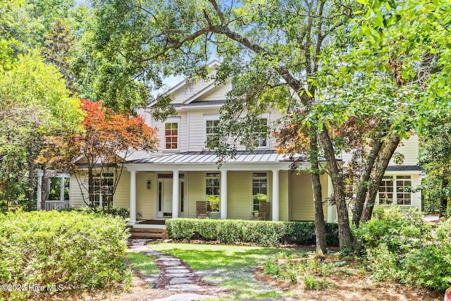 6932 Runningbrook Ter, Wilmington, NC 28411 - view of front of property featuring a standing seam roof, a porch, and a metal roof