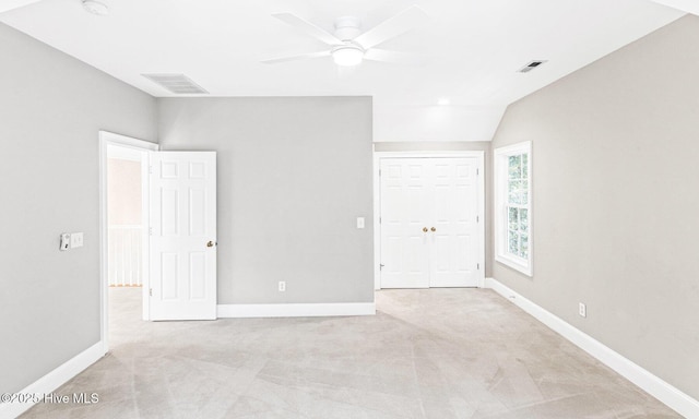 6932 Runningbrook Ter, Wilmington, NC 28411 - unfurnished bedroom with light carpet, lofted ceiling, ceiling fan, and a closet