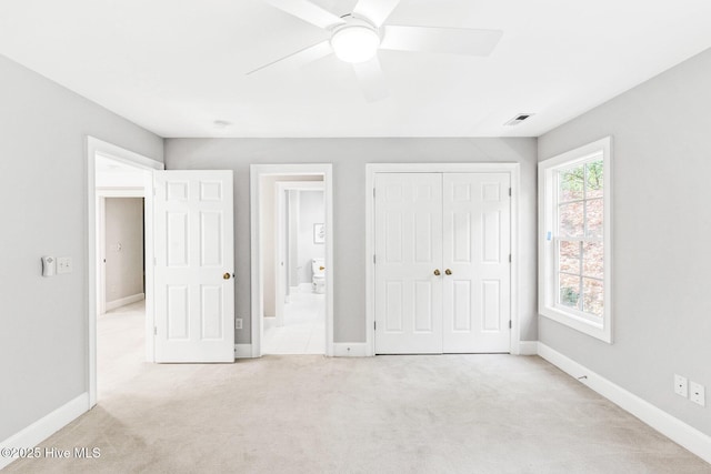 6932 Runningbrook Ter, Wilmington, NC 28411 - unfurnished bedroom with light carpet, a closet, and ceiling fan