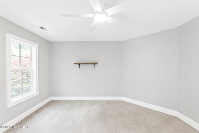 6932 Runningbrook Ter, Wilmington, NC 28411 - spare room featuring light carpet, healthy amount of natural light, and ceiling fan
