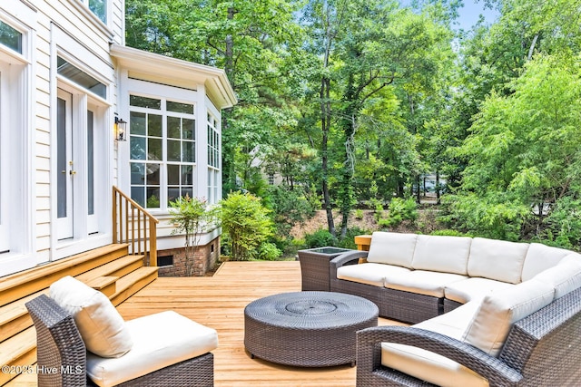 6932 Runningbrook Ter, Wilmington, NC 28411 - wooden terrace with outdoor lounge area, entry steps, and view of scattered trees