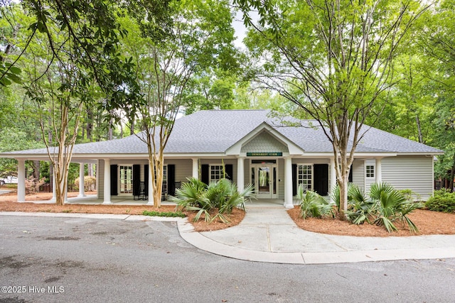 6932 Runningbrook Ter, Wilmington, NC 28411 - view of front of house with a porch, roof with shingles, and french doors