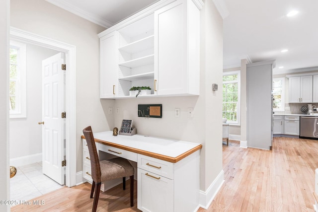 6932 Runningbrook Ter, Wilmington, NC 28411 - office with crown molding, built in desk, light wood finished floors, and recessed lighting