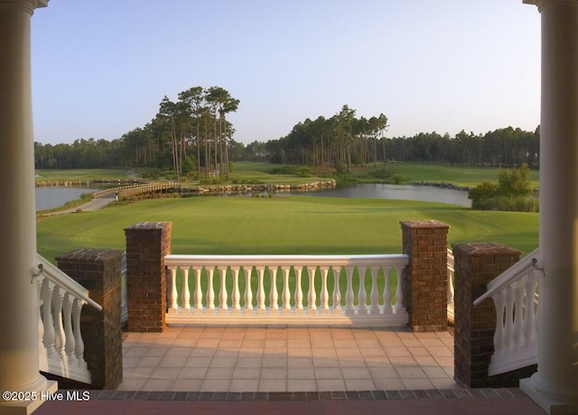 view of patio / terrace featuring a water view and golf course view