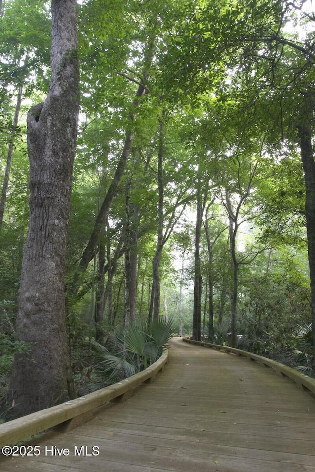 exterior space featuring a wooded view