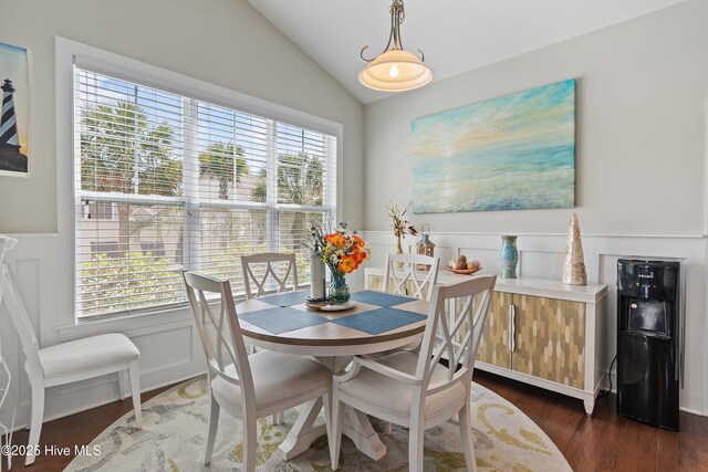carpeted bedroom featuring baseboards, a ceiling fan, and a raised ceiling