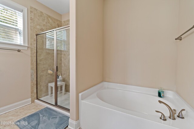 bathroom with tile patterned flooring, toilet, plenty of natural light, and vanity