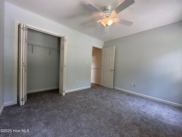 146 Olde Point Rd, Hampstead, NC 28443 - unfurnished bedroom with dark carpet, a textured ceiling, a closet, and ceiling fan