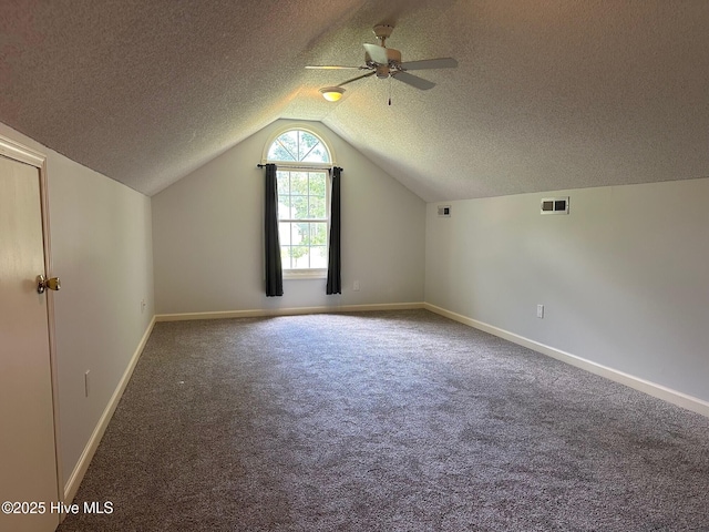 146 Olde Point Rd, Hampstead, NC 28443 - additional living space with a ceiling fan, carpet floors, lofted ceiling, and a textured ceiling